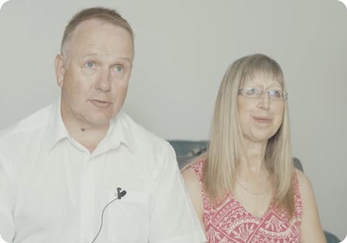 Screenshot of man and woman talking about pharmacy sale on video