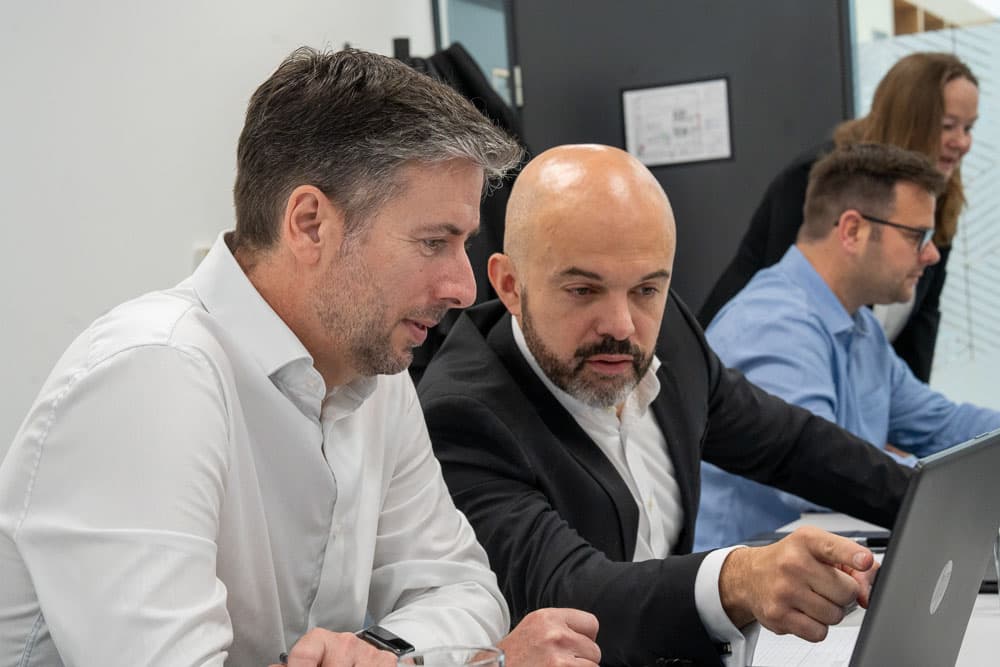 Paul and Matteo working at a laptop together