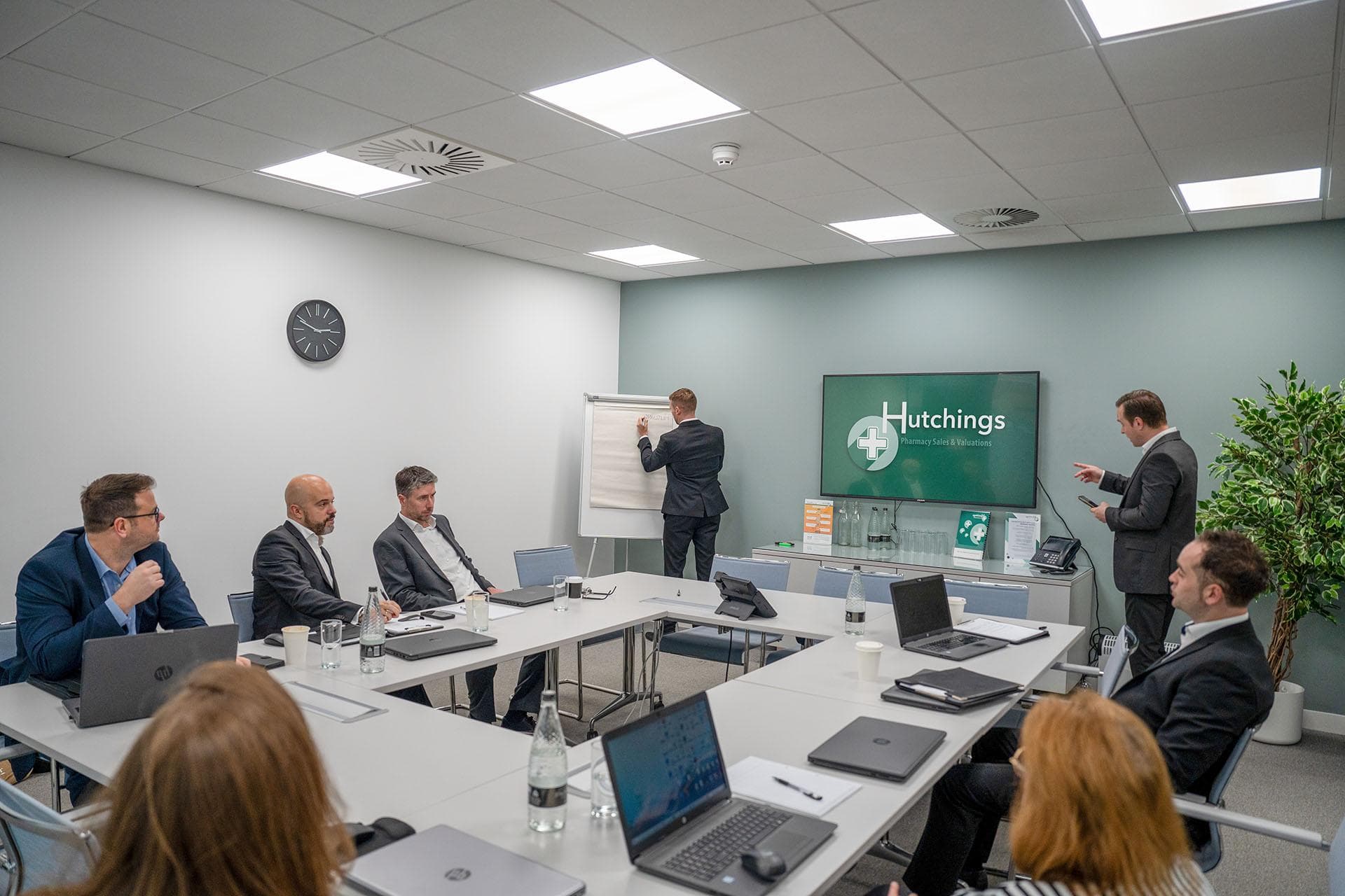 Hutchings Pharmacy presentation in a boardroom meeting