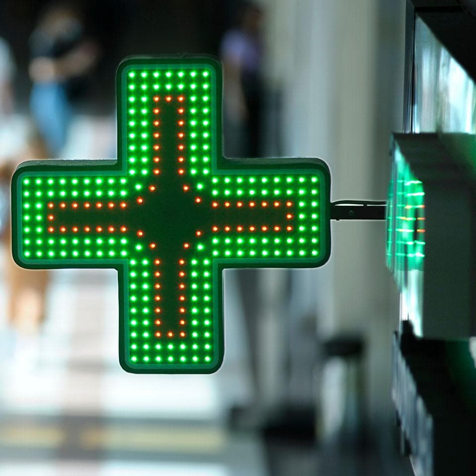 Neon green pharmacy sign