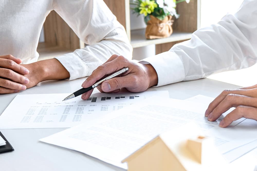 2 pharmacists reviewing pharamacy sale documentation