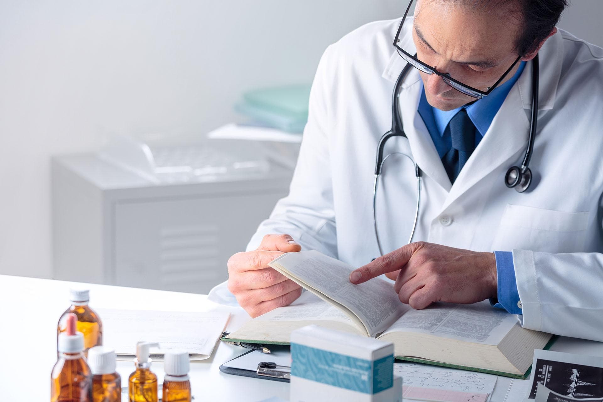 Pharmacist reading a medical journal