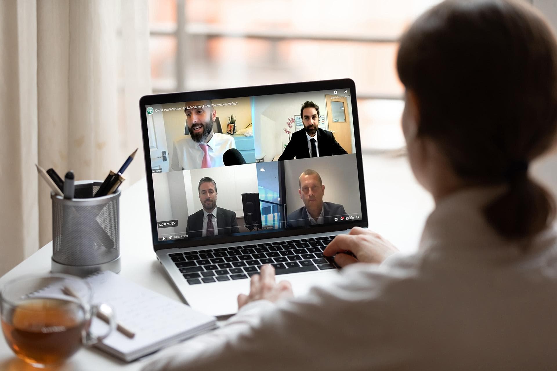 Woman on a conference call with the Hutchings Pharamacy team